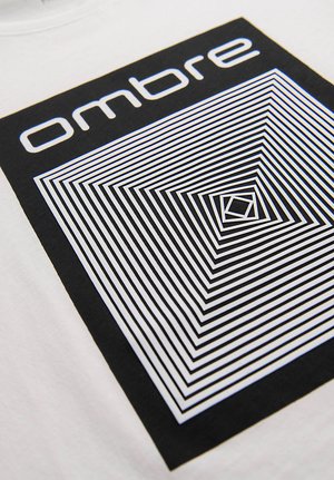 Lignes carrées géométriques en noir et blanc formant un motif concentrique avec le mot "ombre" au-dessus sur un fond de tissu blanc.