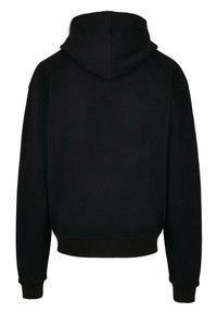 Hanorac negru cu capușă, cu o croială lejeră, având o textură moale, mansete ribelate și un design simplu, fără branding vizibil.