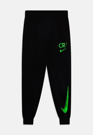 Czarne spodnie sportowe z elastycznym pasem i ściągaczami, z jasnym zielonym napisem "CR7" oraz logo Nike Swoosh na prawej nodze.