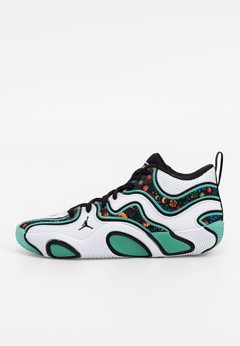 Chaussure de sport blanche avec des accents noirs, motifs floraux et semelle turquoise. Présente un design incurvé et un tissu texturé sur l'ensemble.