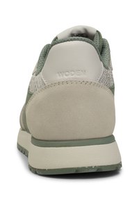 Lightweight sneakers with a green and beige color scheme, featuring a textured mesh upper, suede accents, and a cushioned sole.