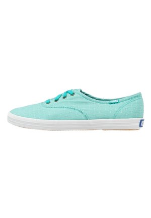 Light turquoise canvas sneaker with white rubber sole, turquoise laces, subtle stitched pattern, and small Keds logo on heel and side.