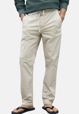 Pantalones de algodón beige con cinturilla ajustable con cordón, diseño de pierna recta, bolsillos laterales y una textura suave y sin patrones.