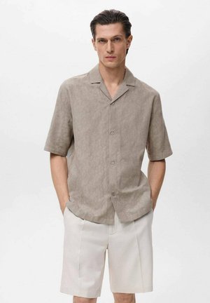 Short-sleeve, light brown linen shirt with a subtle pattern, featuring a open collar and button closure, paired with cream shorts.