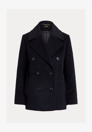 Abrigo cruzado azul marino de paño, confeccionado en lana, con grandes botones, solapas anchas y bolsillos laterales. Forro interior suave.