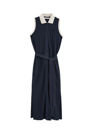 Sleeveless navy blue midi dress with button-down front, white pointed collar, and matching belt tied at the waist.