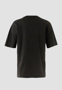 T-shirt en coton noir à manches courtes, avec un col rond et un design simple. Texture lisse avec une coupe épurée et sans logos ni motifs visibles.
