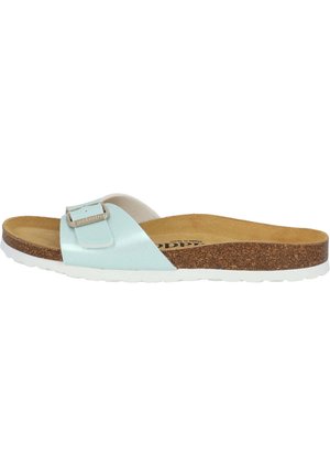 Light blue slide sandal with a single adjustable strap, metal buckle, cork footbed, and white rubber sole. Smooth texture throughout.