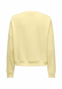Sweat-shirt à manches longues de couleur jaune clair unie, avec poignets et ourlet côtelés, montré de dos sur fond blanc.