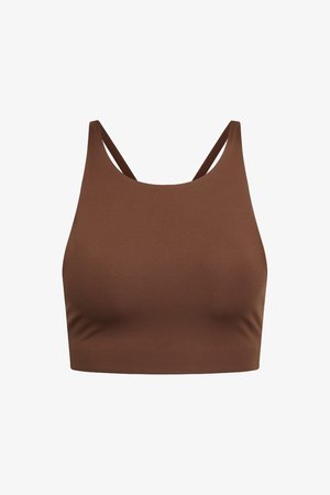 Brūns īss topiņš ar gludu tekstūru, kuru rotā plānas, regulējamas siksnas un minimālistisks dizains, piemērots kārtošanai vai ikdienas valkāšanai.