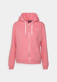 Růžová mikina na zip s kapucí na stažení, klokankovými kapsami, manžetami se zúžením a malým vyšitým logem na hrudi.