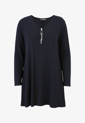 Navy blue long-sleeve tunic top made of soft fabric, featuring a V-neck with a silver zipper detail, tailored for a relaxed fit.