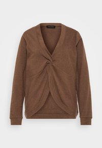 Maglione marrone con scollo a V profondo e design anteriore attorcigliato. Maniche lunghe e texture morbida. Etichetta che reca la dicitura "ANNA FIELD."