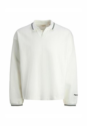 Hvit langermet poloshirt med vertikal ribbet tekstur, v-hals og svart-hvit stripet krage. Inkluderer brodert logo på ermet.