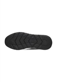 Suela de zapatilla negra con patrones de goma texturizada, que presenta formas hexagonales y rectangulares para agarre y soporte.