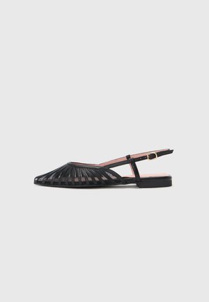 Black slingback sandals with an open toe, featuring a striped design and a small heel. Smooth texture with a gold-tone buckle accent.