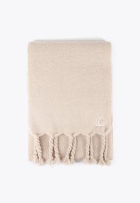 Beige uldet tæppe med tekstureret vævet finish, prydet med fletfringe langs kanten og et "LC" logo i nederste hjørne.