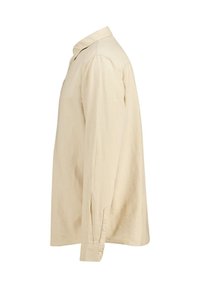 Camicia beige a maniche lunghe realizzata in un tessuto leggero, con colletto a punta e polsini con bottoni, dalla texture liscia e dal fit rilassato.