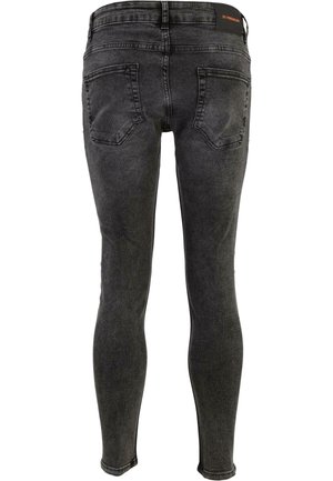 Zwarte denim skinny jeans met een vervaagde afwerking, vijf zakken en een middelhoge tailleband. Kenmerkt zich door ton-sur-ton stiksels en een gladde textuur.