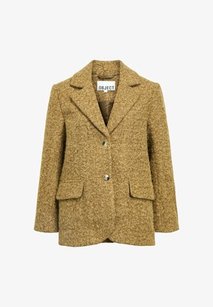 Brauner strukturierter Blazer mit Reverskragen, zwei Fronttaschen, drei Knöpfen und einem gefütterten Innenleben. Hergestellt aus einem weichen, flauschigen Stoff.