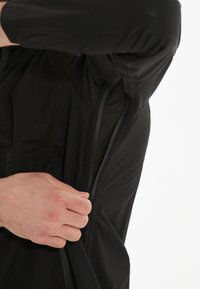 Endurance KOMINT - Runningjack -  black
