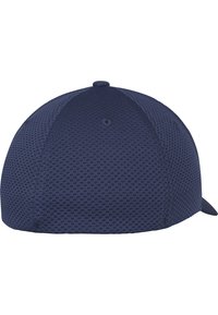Navy blue cap with a textured mesh fabric, rounded crown, and a curved brim. Features vent holes and a decorative button on top.