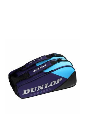 Dubbele compartimenten Dunlop sporttas in blauw en zwart met draagriemen en zichtbare merknaam aan de zijkant.