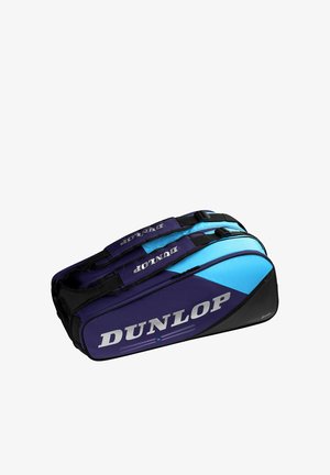 Bolsa deportiva Dunlop de doble compartimento en azul y negro con correas de transporte y nombre de la marca visible en el lateral.