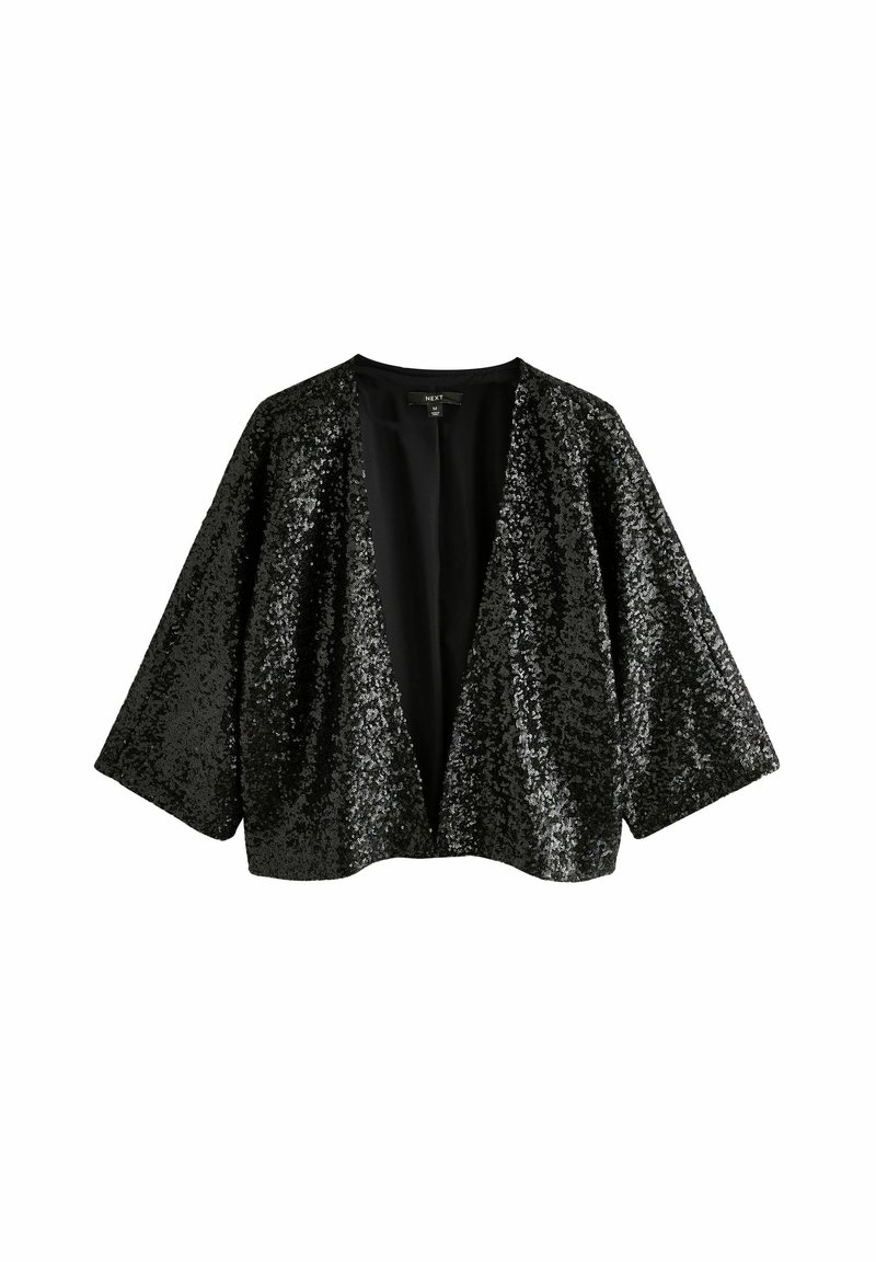 Veste noire pailletée avec un décolleté en V et de larges manches chauve-souris. L'intérieur est uni, contrastant avec la texture et la surface brillantes de l'extérieur.