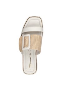 White slide sandal featuring a flat sole, square toe, and wide woven strap in beige with a large rectangular buckle detail.
