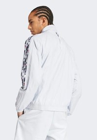 adidas Sportswear PRIDE TIRO TRACK Training jacket halo blue