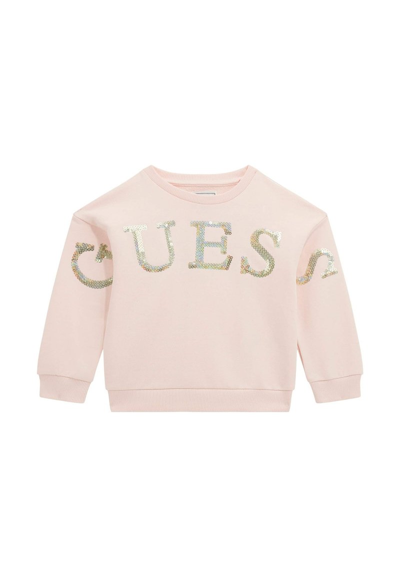 Heller rosa Langarm-Sweatshirt mit schimmernden Paillettenbuchstaben, die "GUESS" über der Brust und an den Ärmeln spell.
