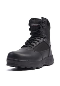 Black tactical boot with a smooth leather toe, textured fabric panels, lace-up front, and rubber sole featuring pronounced tread for traction.
