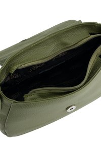 Olive green leather handbag with a textured exterior, featuring a zippered interior and a magnetic snap closure. Interior logo lining visible.