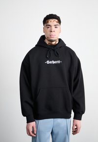 Black hooded sweatshirt with a front pocket and drawstring, featuring a graphic logo in white. Smooth fabric, relaxed fit.