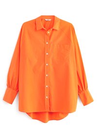 Chemise orange à boutons, fabriquée en tissu léger, dotée d'une poche poitrine, de manches raglan et d'un ourlet courbé avec une coupe décontractée.