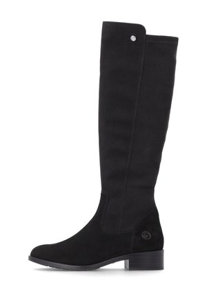 Botte haute en daim noir avec talon bloc bas, bout rond, surpiqûre latérale et petit bouton métallique près du haut. Pas de lacets ni de fermetures éclair visibles.