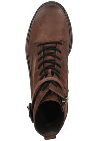 Brown suede ankle boots with a round toe, lace-up front, side zipper, and contrasting stitching detail along the sole.