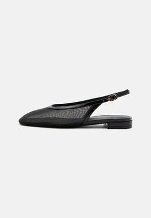 Black slingback flat shoe with pointed toe, mesh upper, adjustable buckle strap, and low stacked heel on white background.