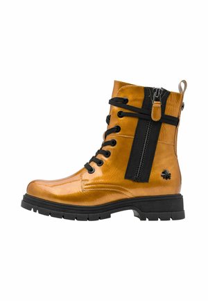 Glossy tan ankle boot with black laces, a side zipper with pull tab, thick black sole, and a small flower detail near the heel.