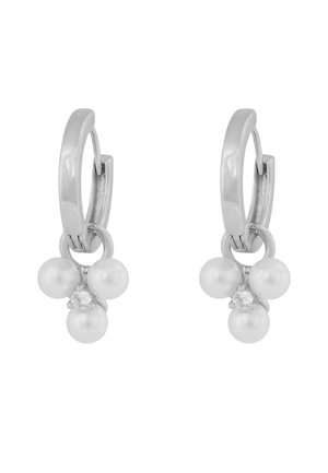 Silver hoop earrings with three small white pearls and a central clear gemstone dangling from each hoop.