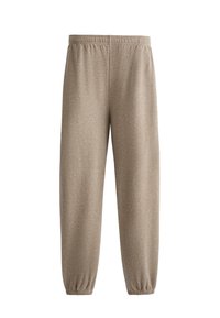 Vaaleanruskeat collegehousut, jotka on valmistettu pehmeästä ja joustavasta kankaasta. Niissä on joustava vyötärö ja käärityt lahkeet nilkoissa.