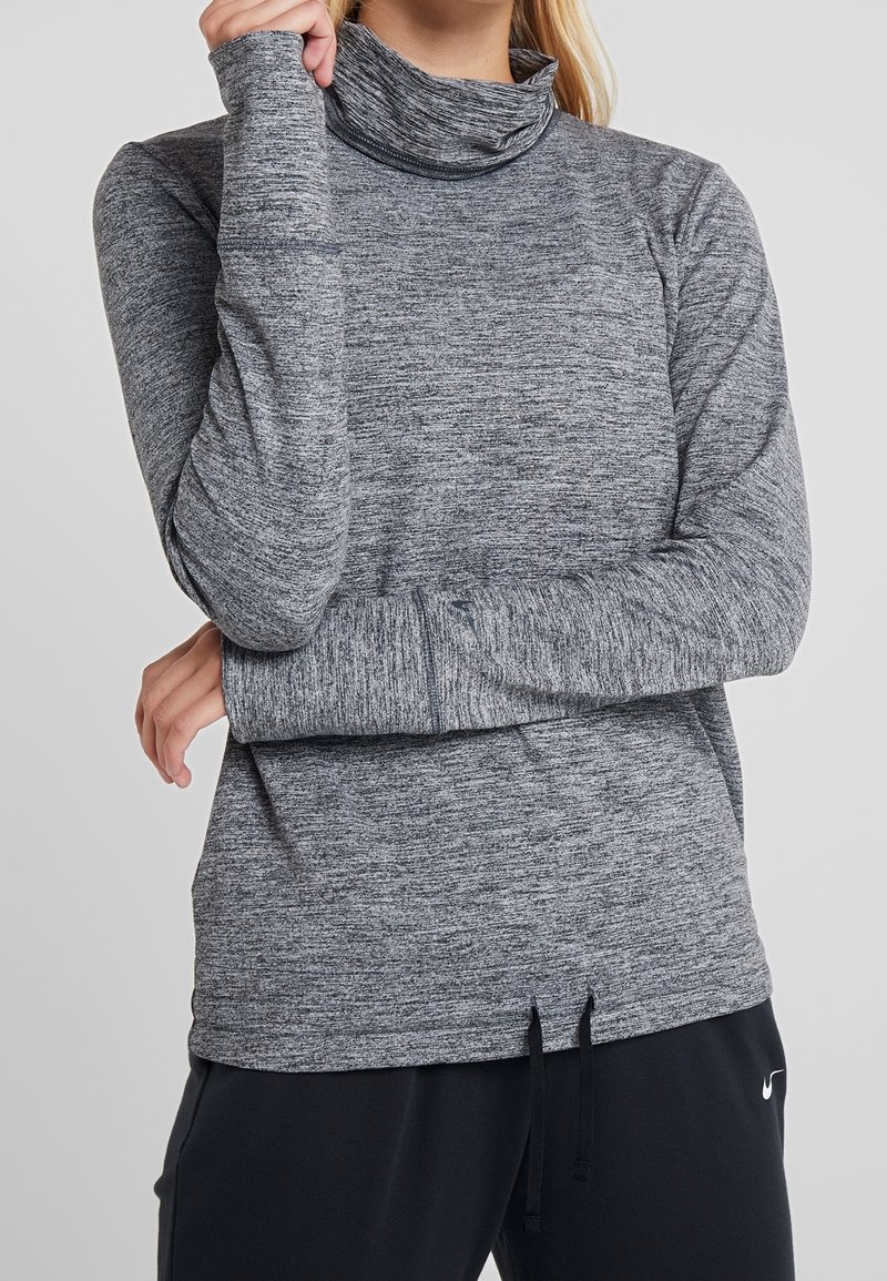 Grauer langärmelig hoher Kragen aus strukturiertem, leichtem Material. Verfügt über einen hohen Hals und eng anliegende Bündchen mit einer lässigen Silhouette.