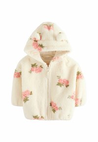 Hoodie en polaire crème avec fermeture éclair sur le devant. Présente des motifs floraux en rose et vert. La capuche est ornée d'oreilles d'ours pour un détail supplémentaire.