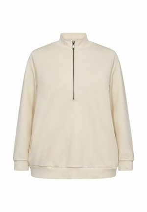 Pull en polaire couleur crème avec un col montant, fermeture éclair à mi-hauteur, et poignets et ourlet côtelés. Texture douce, coupe décontractée et design minimaliste.