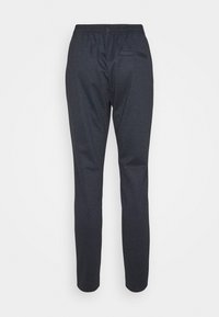Pantalons sur mesure en marine avec un motif à carreaux, dotés d'une taille élastique et d'un design ajusté. Poche arrière renforcée incluse.