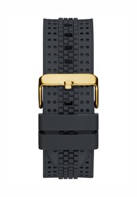 Schwarzes Uhrenarmband aus Gummi mit strukturierter Oberfläche und Perforationen, befestigt mit einer goldfarbenen Schnalle, konzipiert für Komfort und Atmungsaktivität.