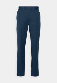 Mörkblå chinos tillverkade av bomullstwill, med en rak bendesign, subtil textur och en enda framknappslåsning.
