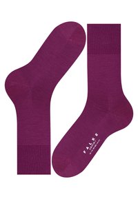 Calcetines morados hechos de un material suave y de punto, con un puño acanalado y un diseño de punta sin costuras. El logo está impreso en la suela.