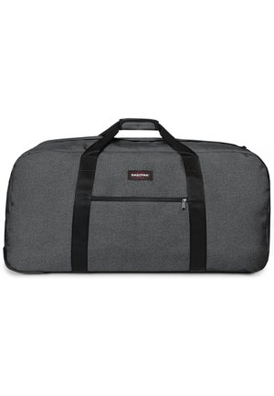 Borsa duffel grigia realizzata in tessuto testurizzato, con doppi manici neri, una tasca laterale con zip e una patch del logo sul davanti.
